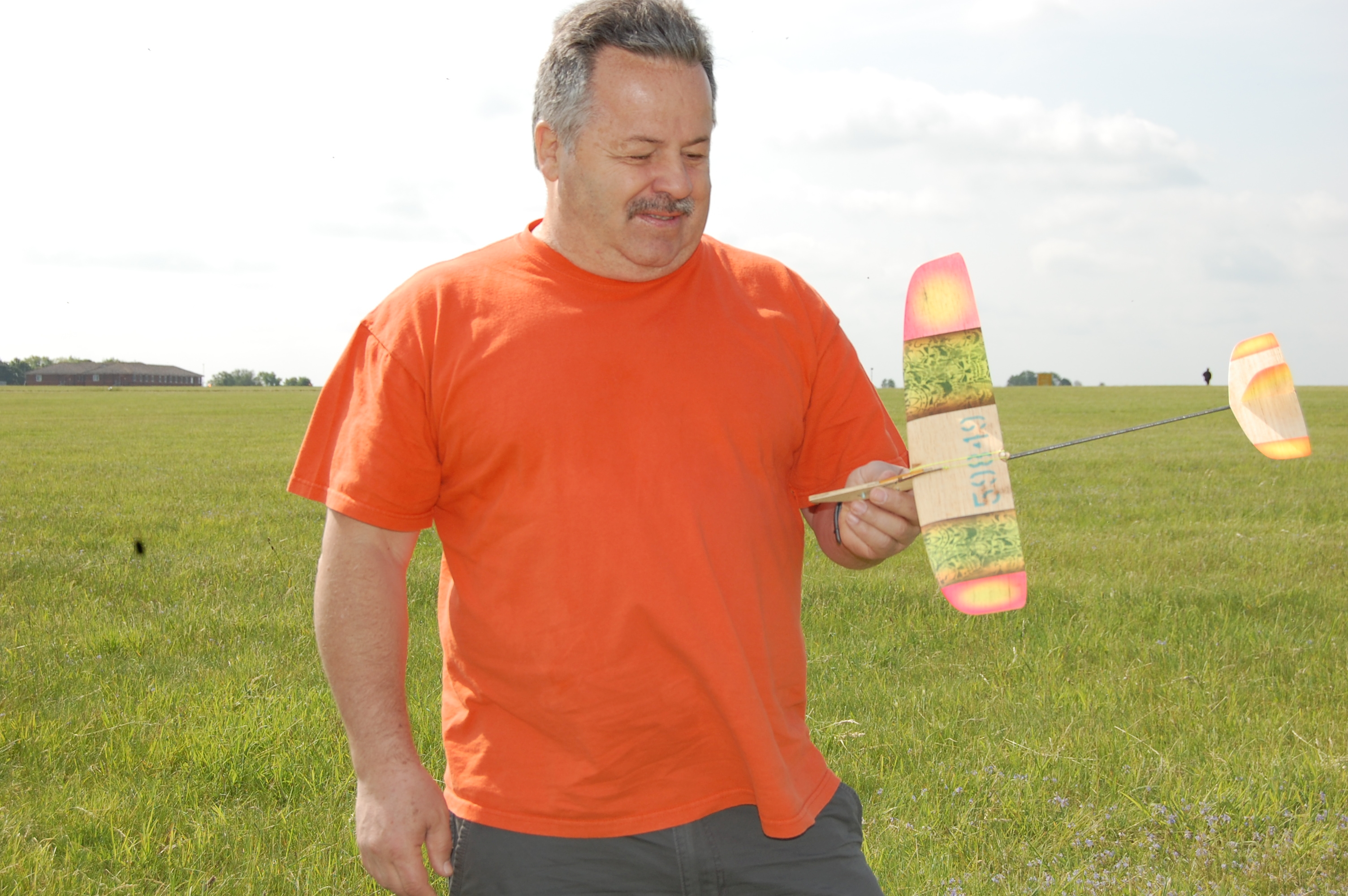 Bruce Kimball, here again from the USA, holding his winning Catapult Glider. Brought several in a special box that fits in the overhead luggage space on air flights.